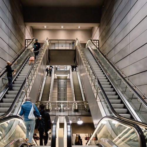 Copenhagen, Denmark - August 12, 2016: People using escalators in the subway of  Copenhagen. Blur motion